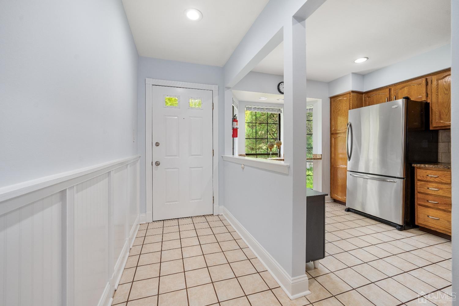 1501 Timber Oaks Road Edison, NJ 08820 - Photo 7 of 17 a view of a refrigerator in kitchen and a window in a room