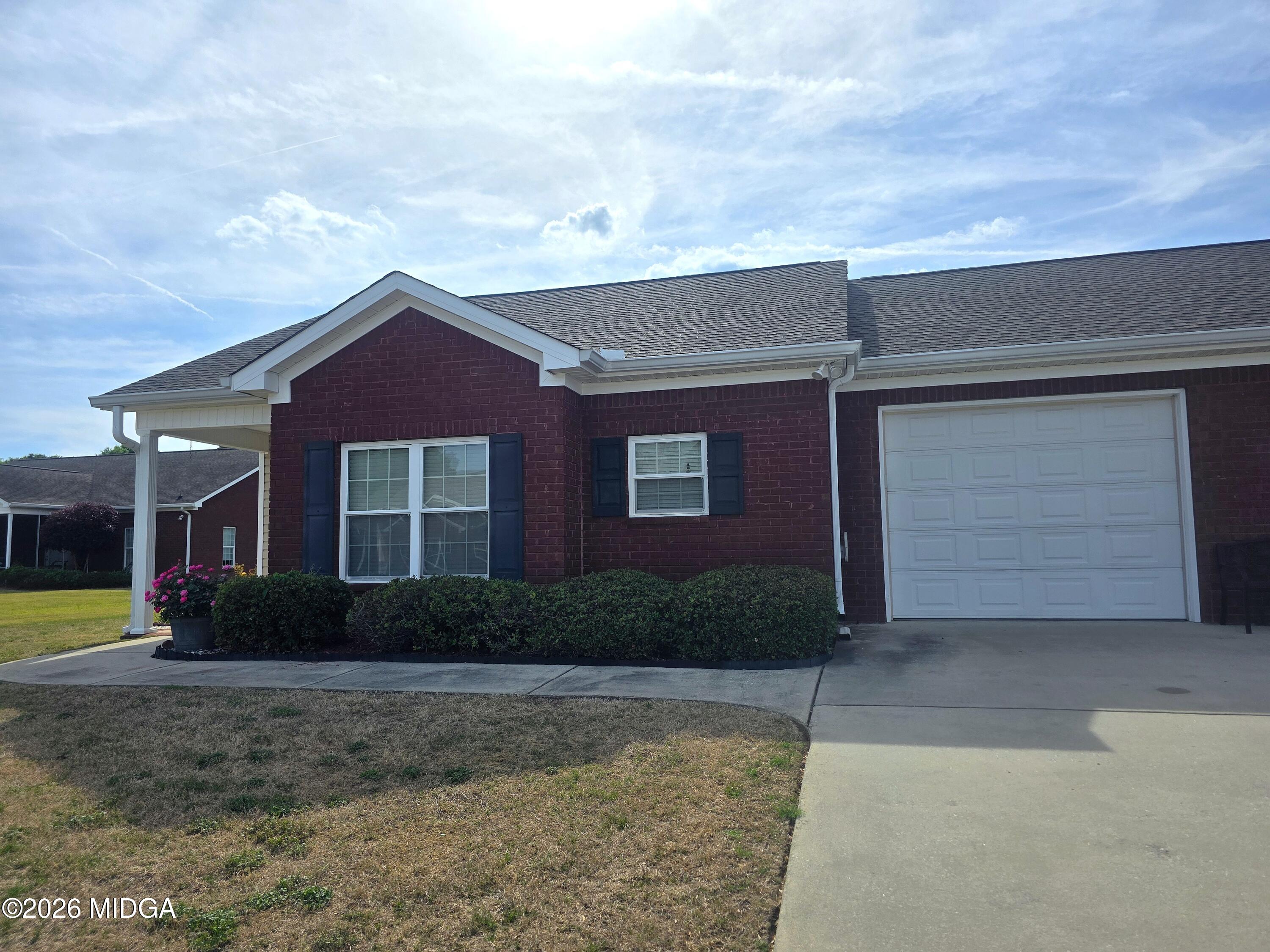 143 Jabrok Circle Macon, GA 31216 - Photo 15 of 15 a front view of a house with garden