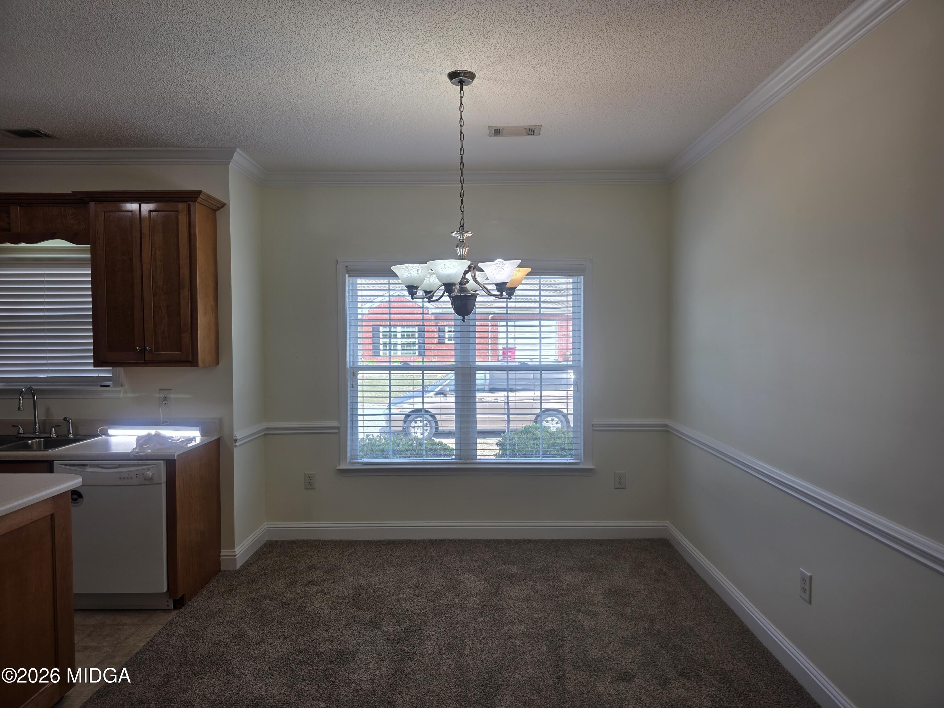 143 Jabrok Circle Macon, GA 31216 - Photo 4 of 15 a room with window and a chandelier