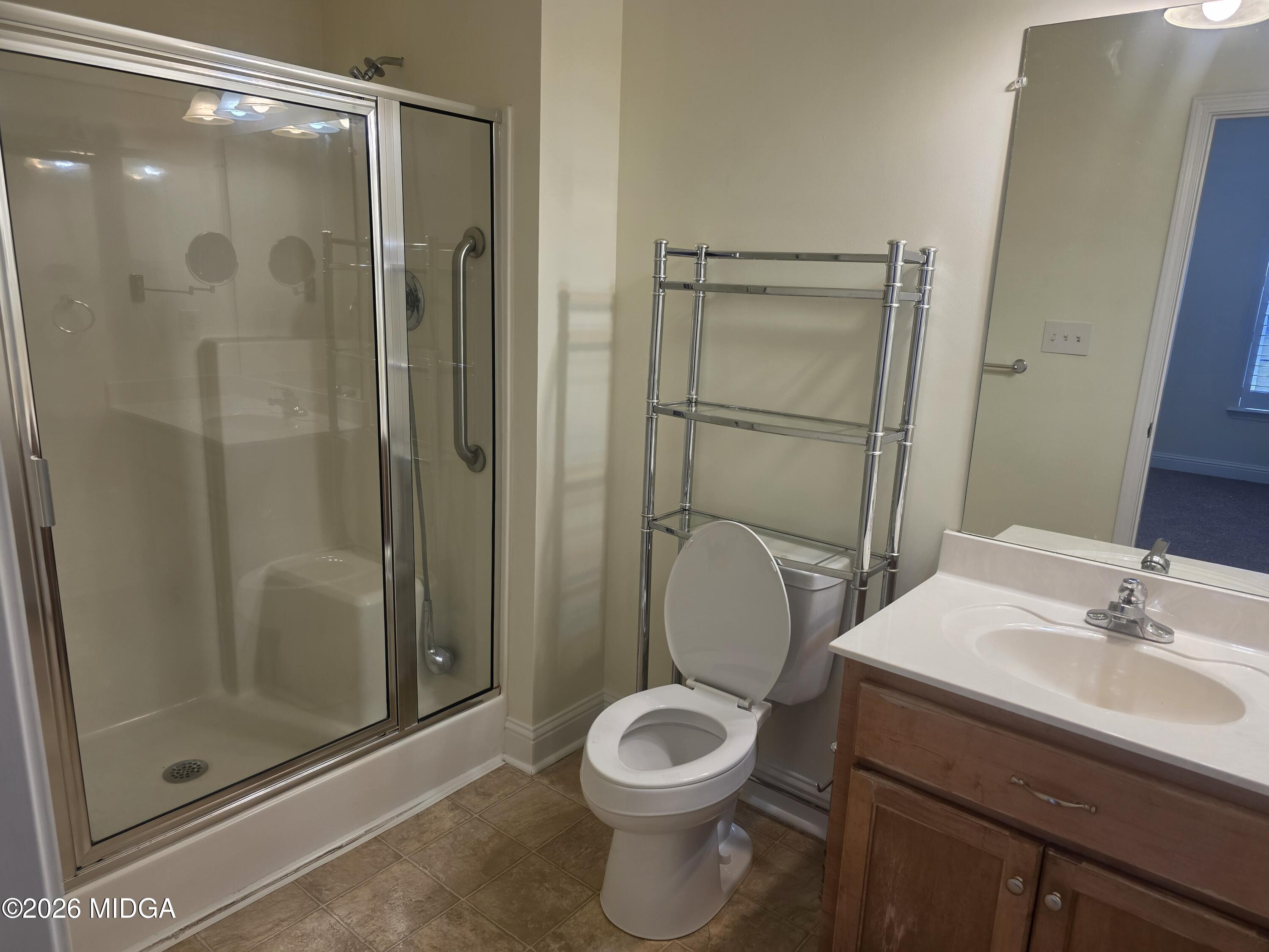 143 Jabrok Circle Macon, GA 31216 - Photo 7 of 15 a bathroom with a toilet a sink and shower