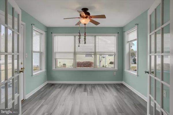 a room with window and ceiling fan