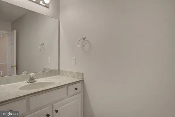 a bathroom with a sink and vanity