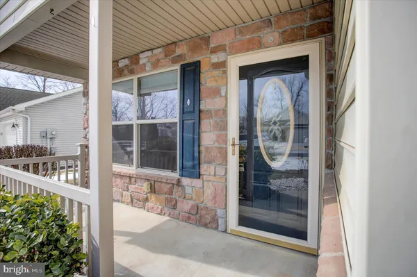 a view of a brick house with a glass door