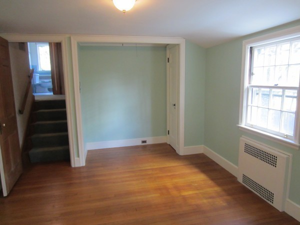 61 Denton Road Wellesley, MA 02482 - Photo 15 of 16 an empty room with wooden floor closet and windows