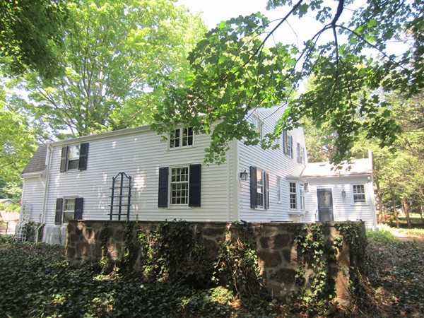 61 Denton Road Wellesley, MA 02482 - Photo 3 of 16 a front view of a house with a garden