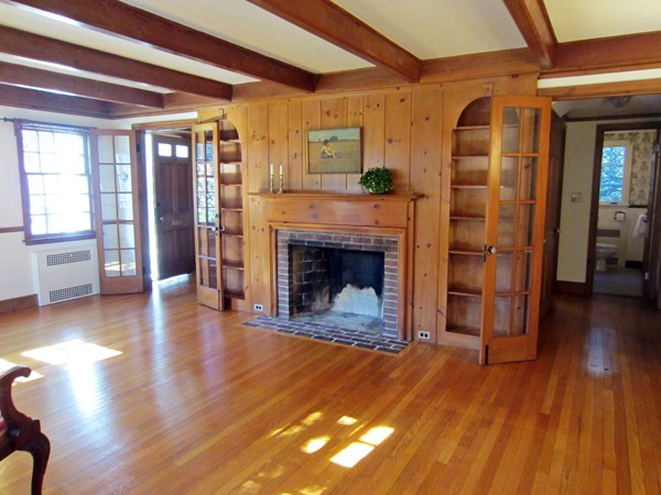 61 Denton Road Wellesley, MA 02482 - Photo 4 of 16 a view of a livingroom with wooden floor and a fireplace