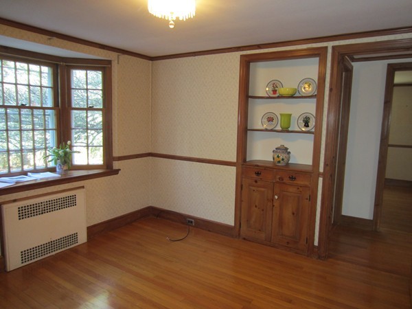 61 Denton Road Wellesley, MA 02482 - Photo 8 of 16 an empty room with wooden floor cabinet and windows