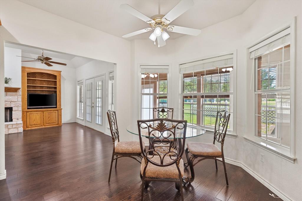 13021 Rudy's Way Streetman, TX 75859 - Photo 12 of 40 Lake-area breakfast nook near Richland Chambers Lake with multiple windows and open sightlines into the spacious living room.