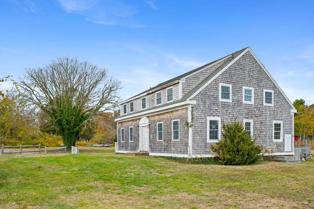 126 Route 28 Harwich, MA 02671 - Photo 11 of 35 a front view of a house with a garden