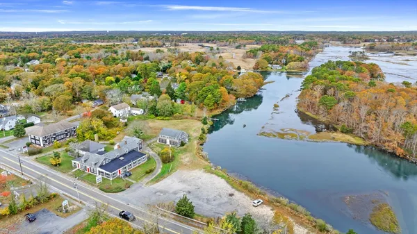an aerial view of residential houses with outdoor space