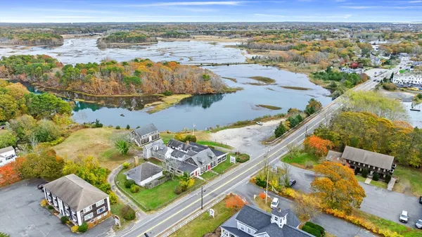 an aerial view of residential houses with outdoor space