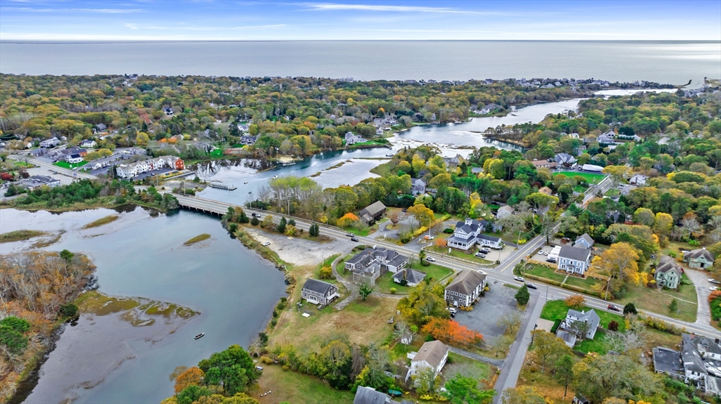 126 Route 28 Harwich, MA 02671 - Photo 5 of 35 an aerial view of a city with lots of residential buildings ocean and mountain view in back