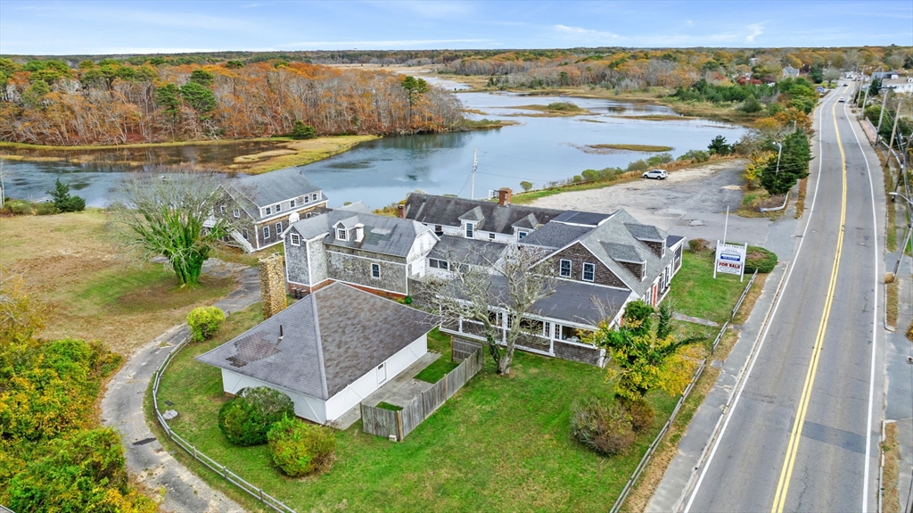 126 Route 28 Harwich, MA 02671 - Photo 9 of 35 an aerial view of residential houses with outdoor space and ocean view