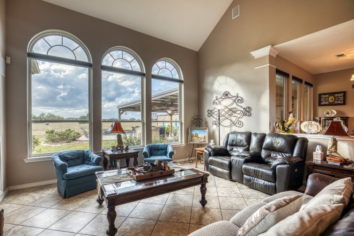 4701 Cedar Hill Road Brenham, TX 77833 - Photo 17 of 50 a living room with furniture and a large window