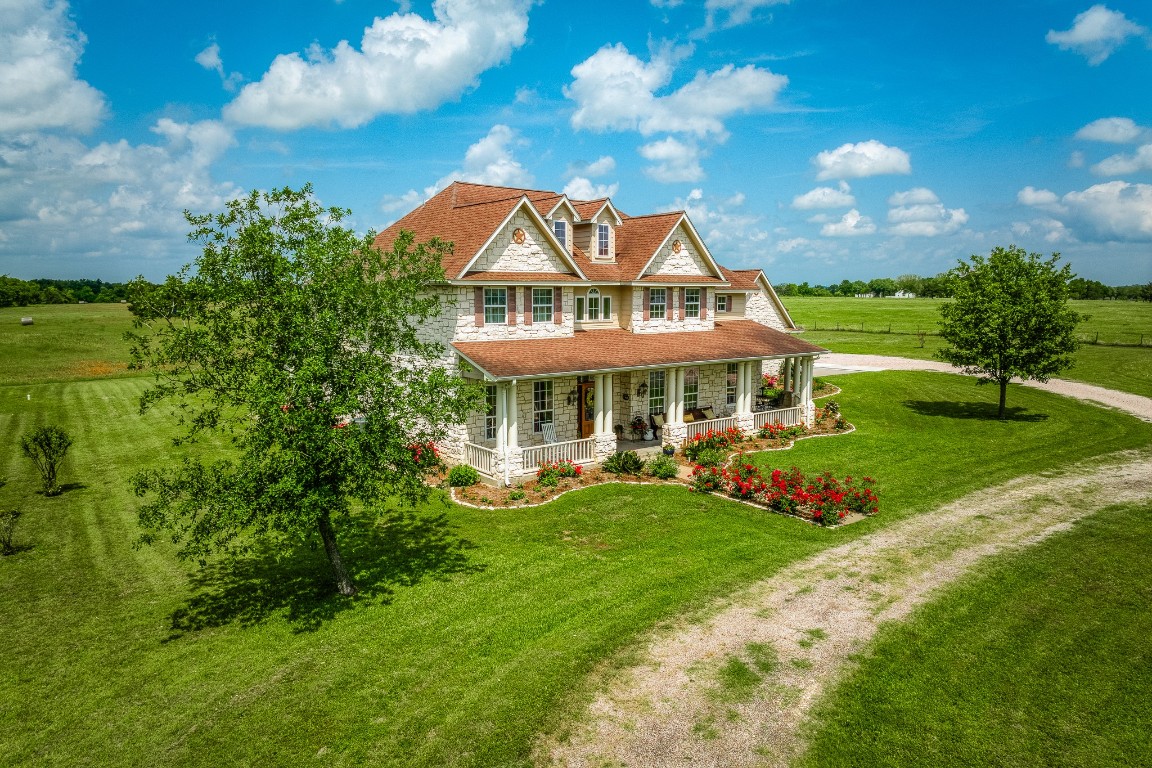 4701 Cedar Hill Road Brenham, TX 77833 - Photo 2 of 50 a front view of a house with a yard