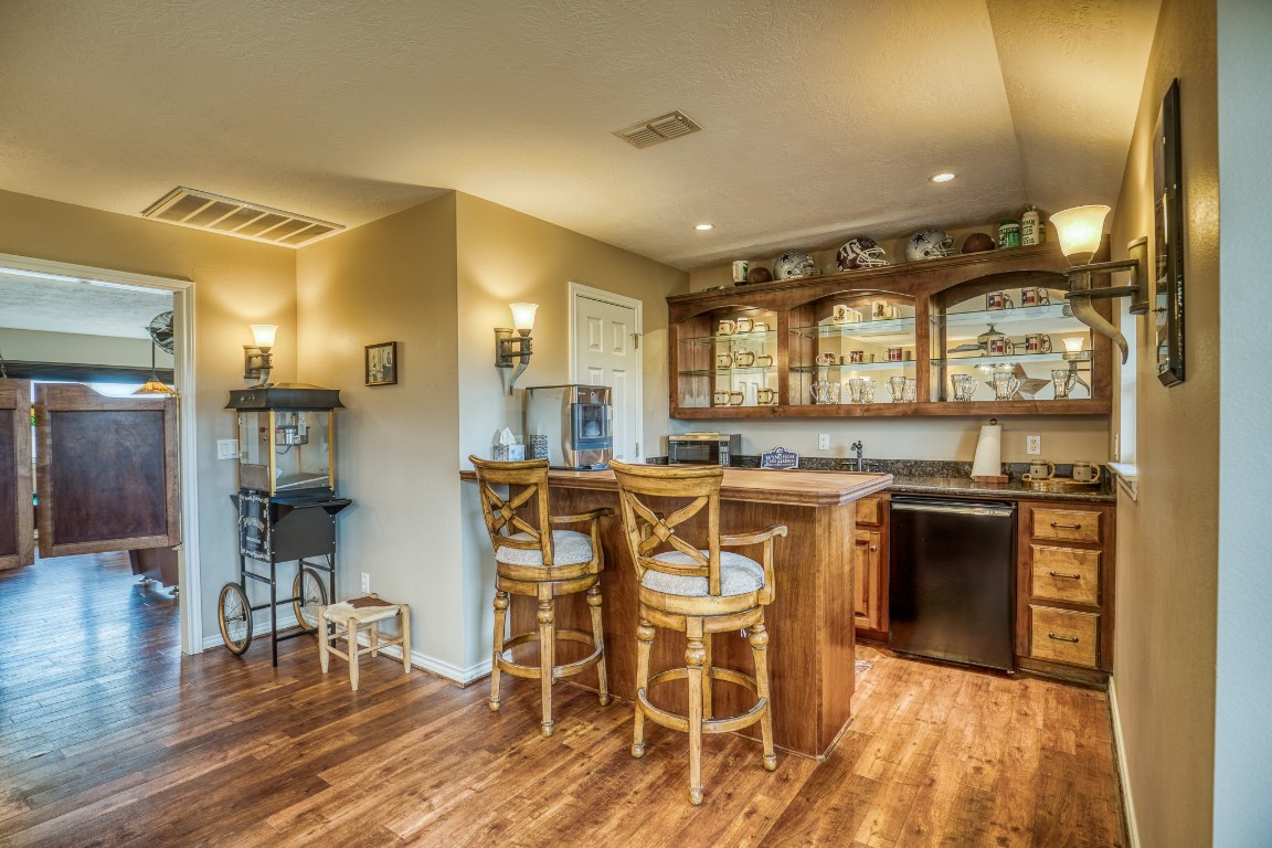 4701 Cedar Hill Road Brenham, TX 77833 - Photo 24 of 50 a kitchen with stainless steel appliances granite countertop a stove and a refrigerator