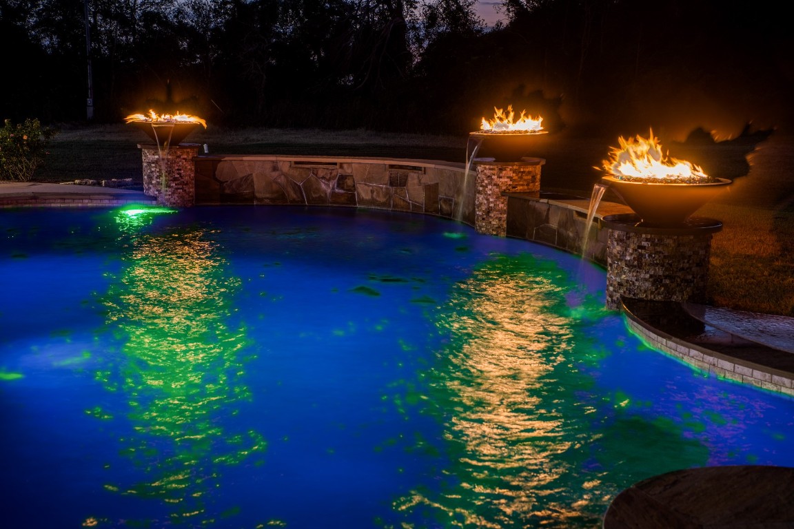 4701 Cedar Hill Road Brenham, TX 77833 - Photo 36 of 50 a swimming pool with a yard in back