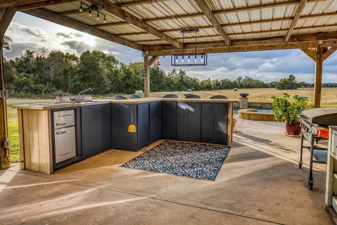 4701 Cedar Hill Road Brenham, TX 77833 - Photo 39 of 50 a view of a couches and table in the patio