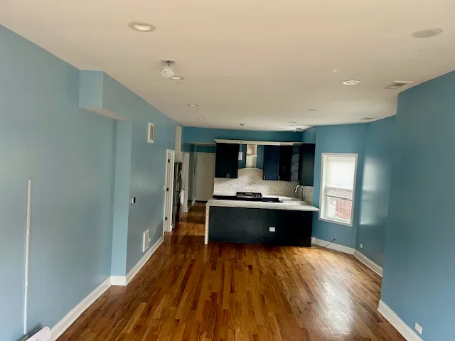 a view of kitchen with sink and stainless steel appliances