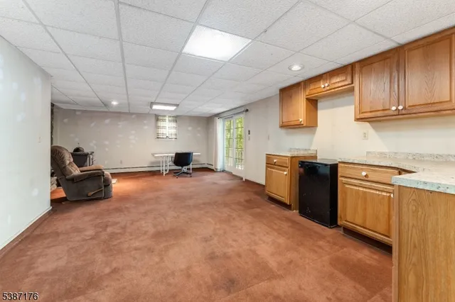 a kitchen with stainless steel appliances granite countertop a stove and a sink with cabinets