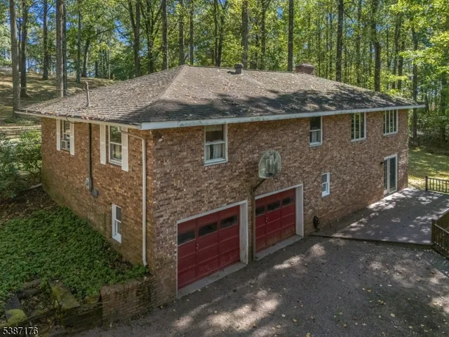 a aerial view of a house with a yard