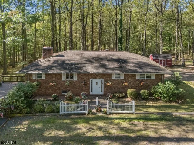 a aerial view of a house with a yard