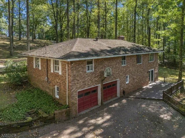 a view of a house with a backyard space
