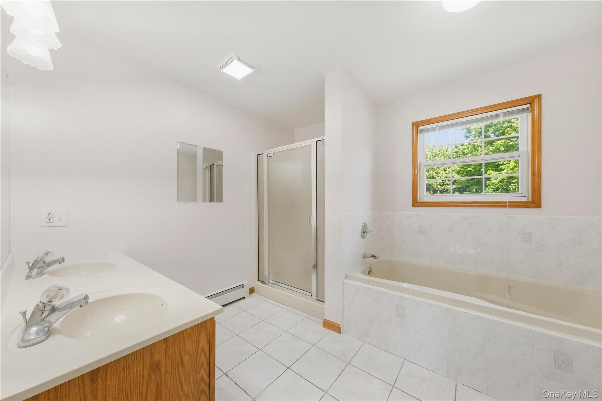 5 Horton Road Washingtonville, NY 10992 - Photo 21 of 42 a bathroom with a tub sink and a shower
