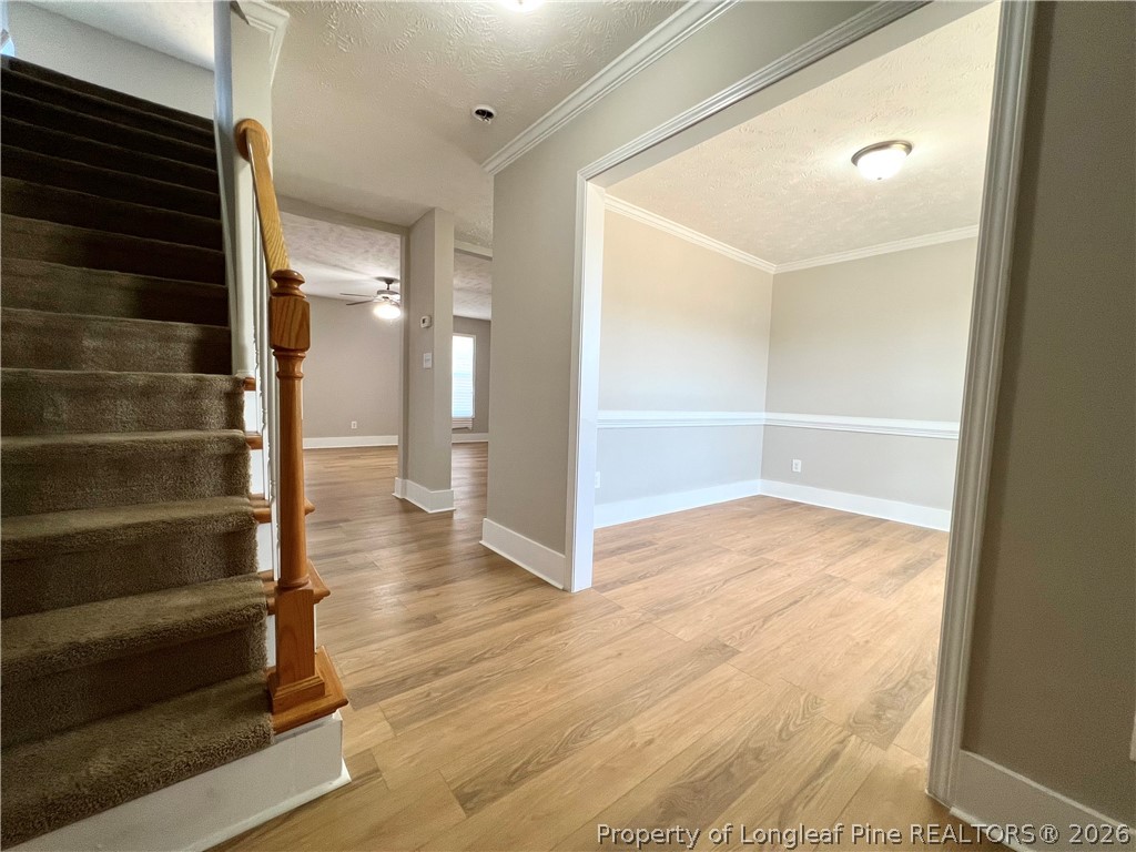 240 Declaration Drive Raeford, NC 28376 - Photo 14 of 37 a view of an empty room with wooden floor and a window