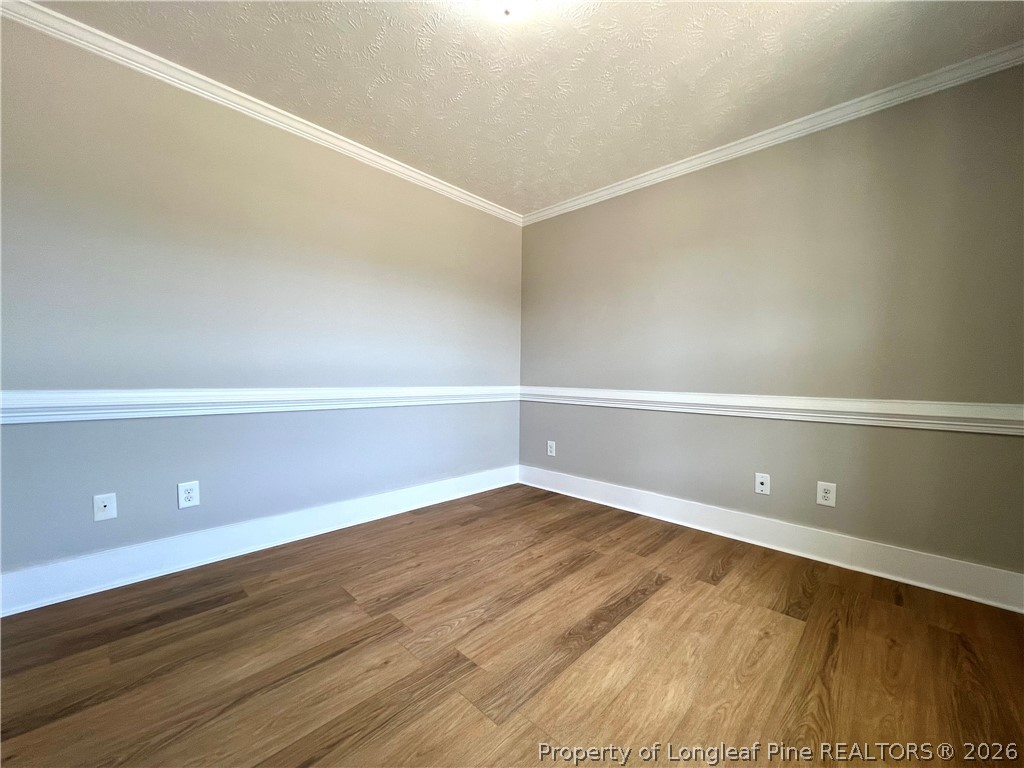 240 Declaration Drive Raeford, NC 28376 - Photo 7 of 37 a view of an empty room with wooden floor