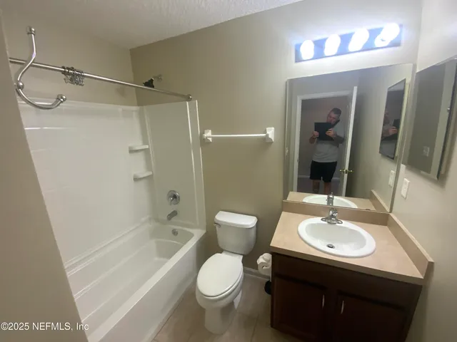a balcony view with couches and wooden floor