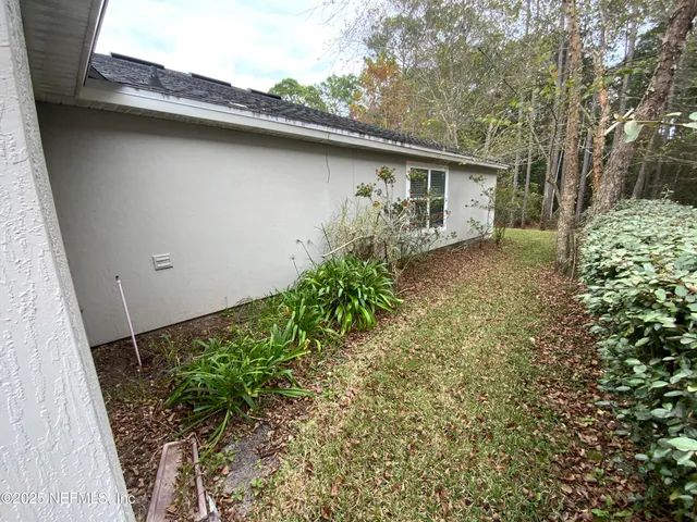 a view of a pathway both side of house