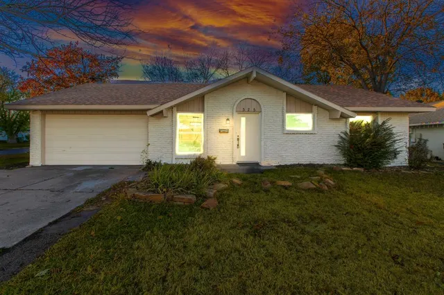 a house with trees in the background