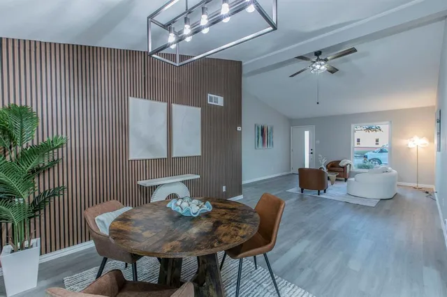 a bedroom with a bed and a potted plant
