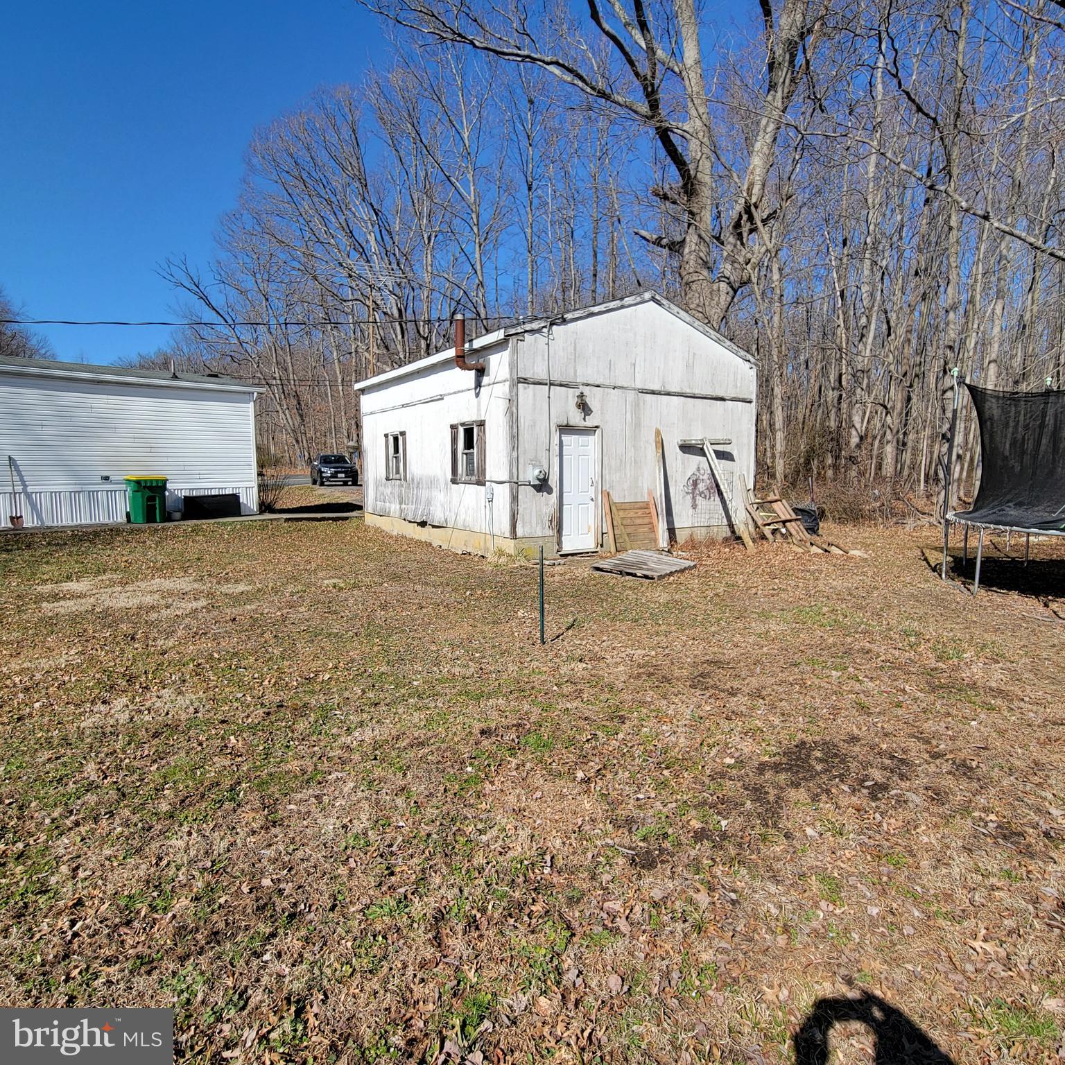 633 Mahan Road Aberdeen, MD 21001 - Photo 4 of 8 a white house covered with tall trees
