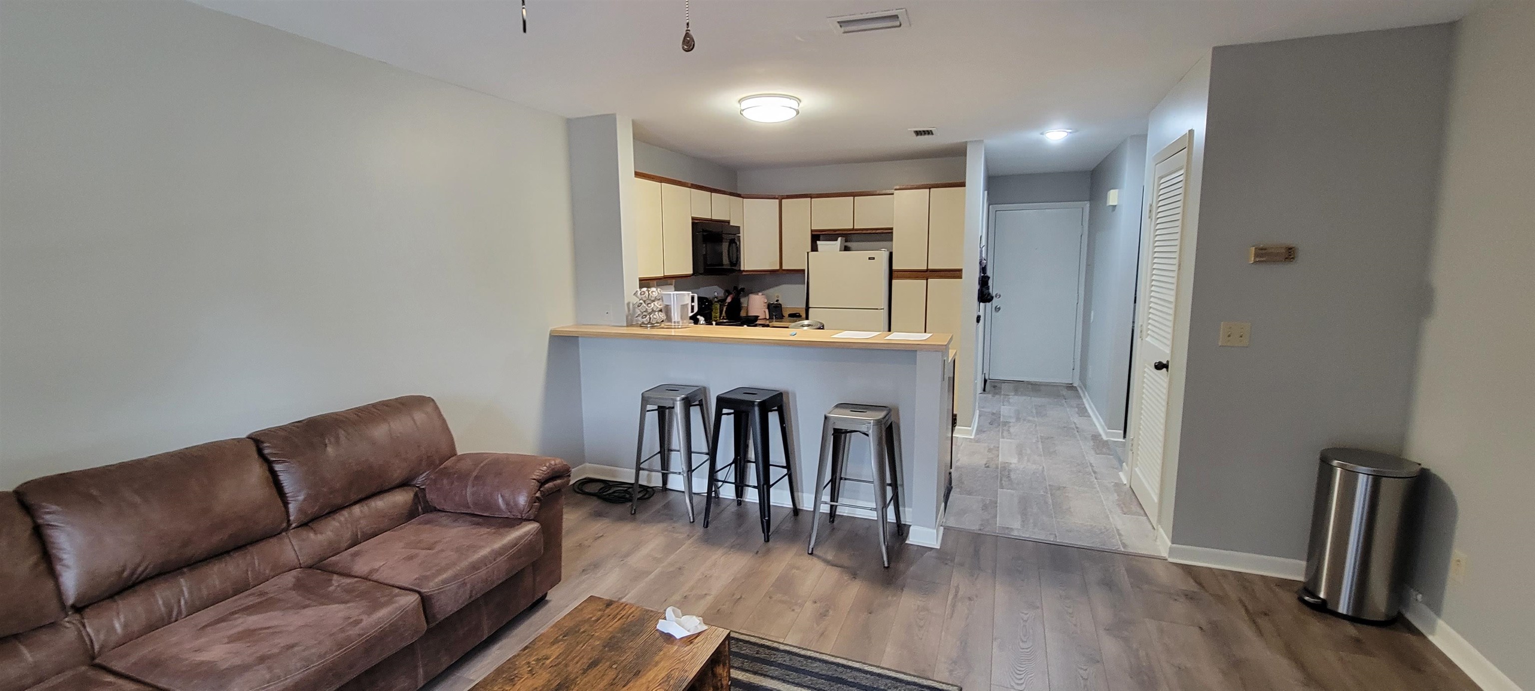 1336 Hunters Road, Unit G Harrisonburg, VA 22801 - Photo 11 of 42 a living room with furniture and a wooden floor