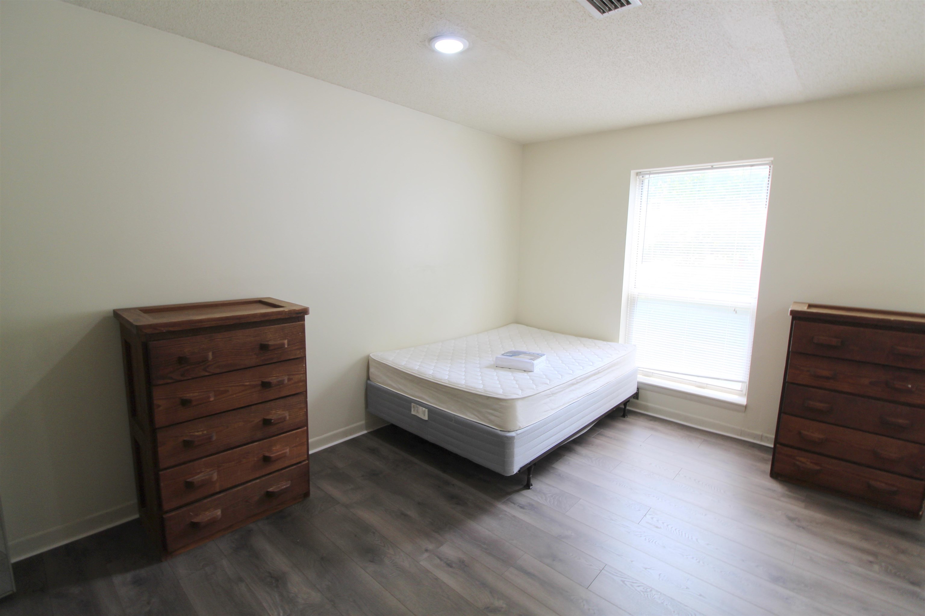 1336 Hunters Road, Unit G Harrisonburg, VA 22801 - Photo 16 of 42 a bedroom with a bed and a dresser