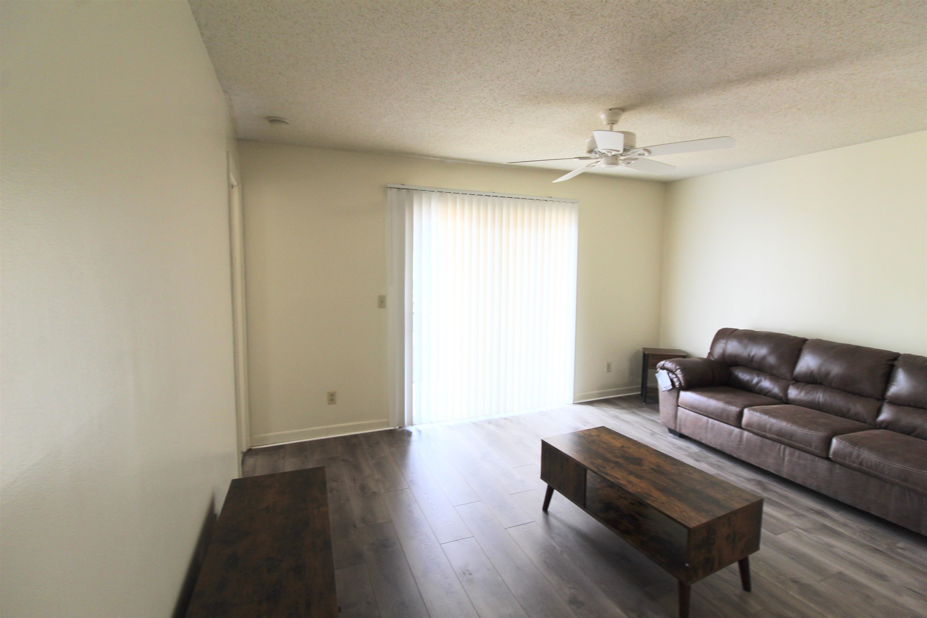 1336 Hunters Road, Unit G Harrisonburg, VA 22801 - Photo 22 of 42 a living room with furniture and a wooden floor