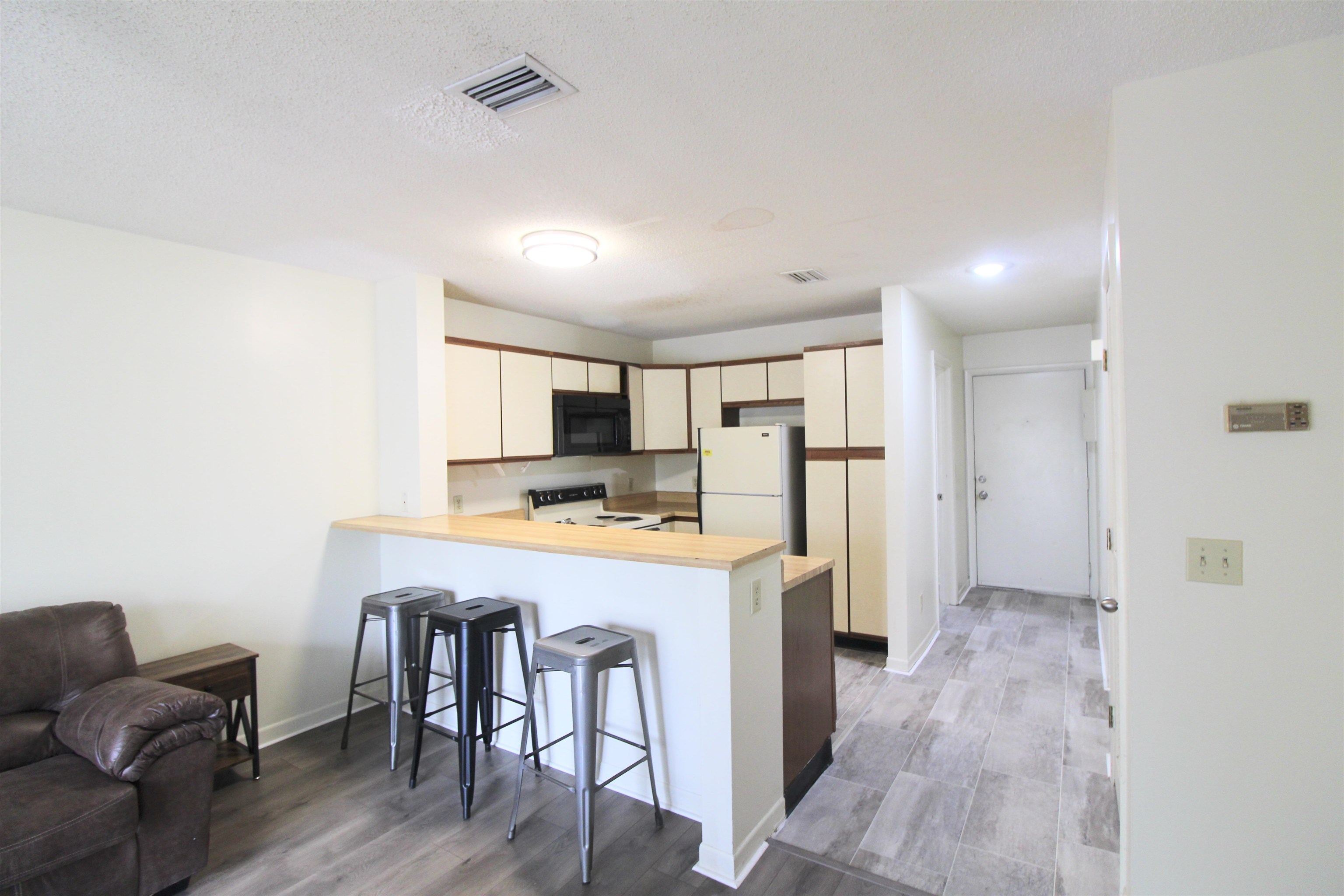 1336 Hunters Road, Unit G Harrisonburg, VA 22801 - Photo 25 of 42 a kitchen with stainless steel appliances a refrigerator and a stove top oven