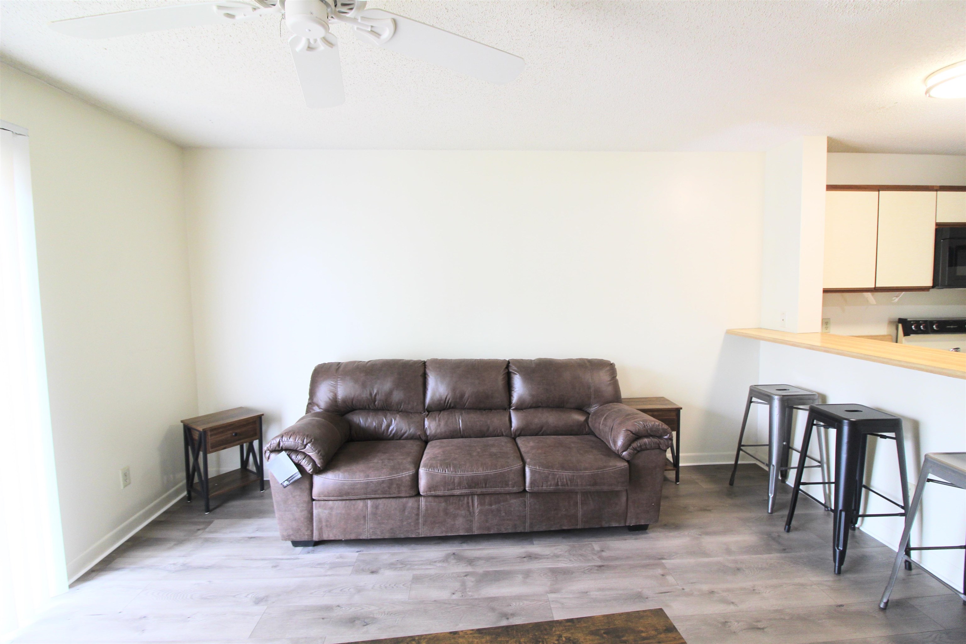 1336 Hunters Road, Unit G Harrisonburg, VA 22801 - Photo 28 of 42 a living room with furniture and a couch