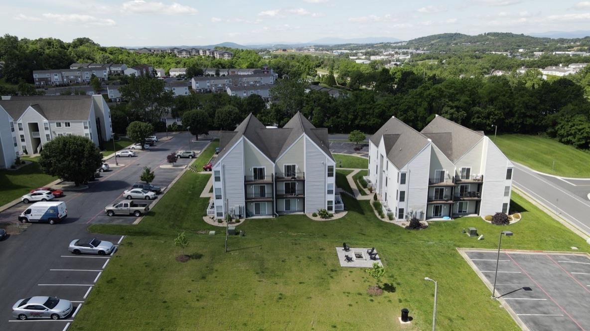 1336 Hunters Road, Unit G Harrisonburg, VA 22801 - Photo 39 of 42 an aerial view of a house with swimming pool garden and mountain view in back