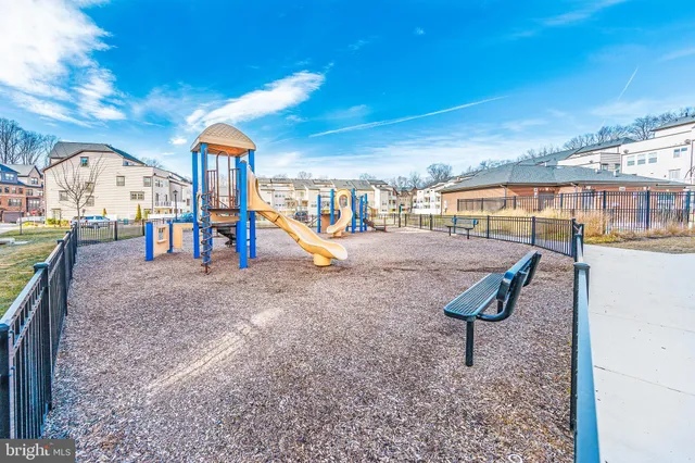 a front view of a building with outdoor space and sitting area