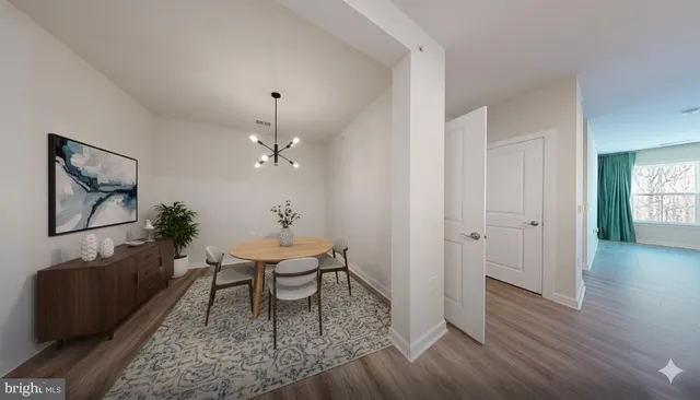 a workspace room with furniture and wooden floor