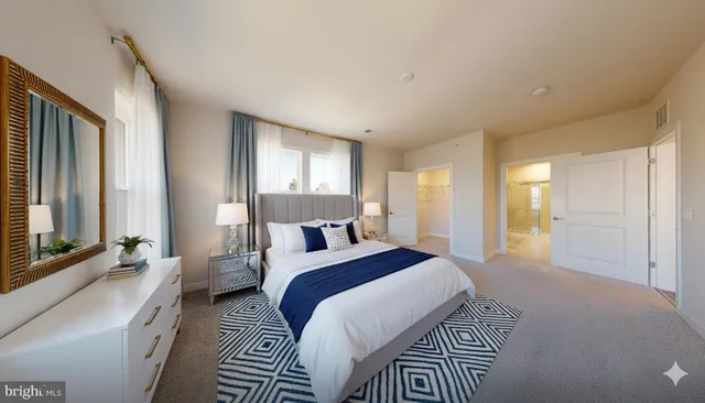 a spacious bedroom with a large bed and a large window