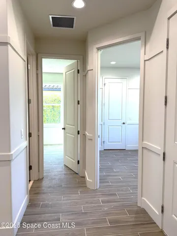 a view of a bathroom with a glass door shower and a sink