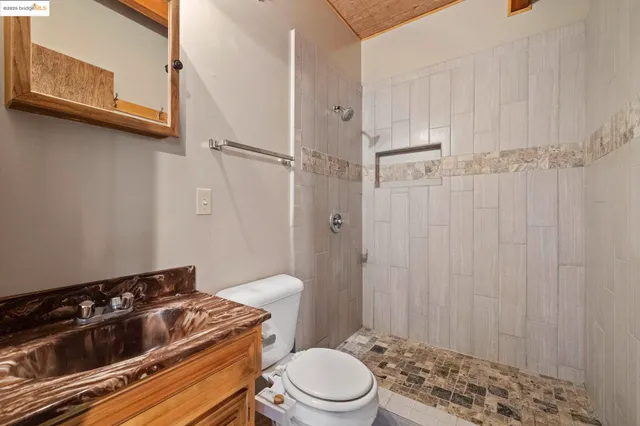 a view of a yard with wooden fence