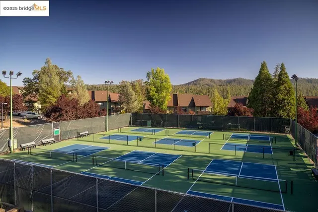 a group of people standing on top of a lake