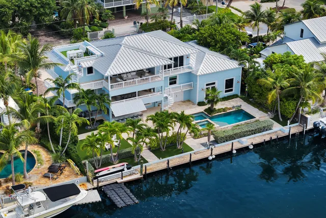 a view of a chairs and table in the backyard