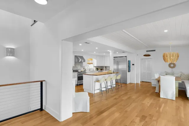 a view of a patio with table and chairs