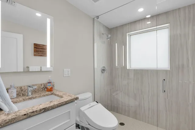 a bedroom with furniture and a flat screen tv